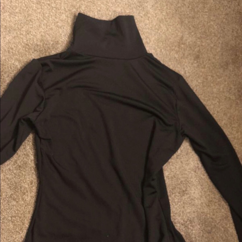 Black turtle neck body suit